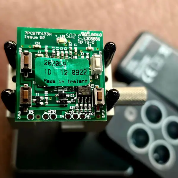 Car remote circuit board held in a jig for soldering