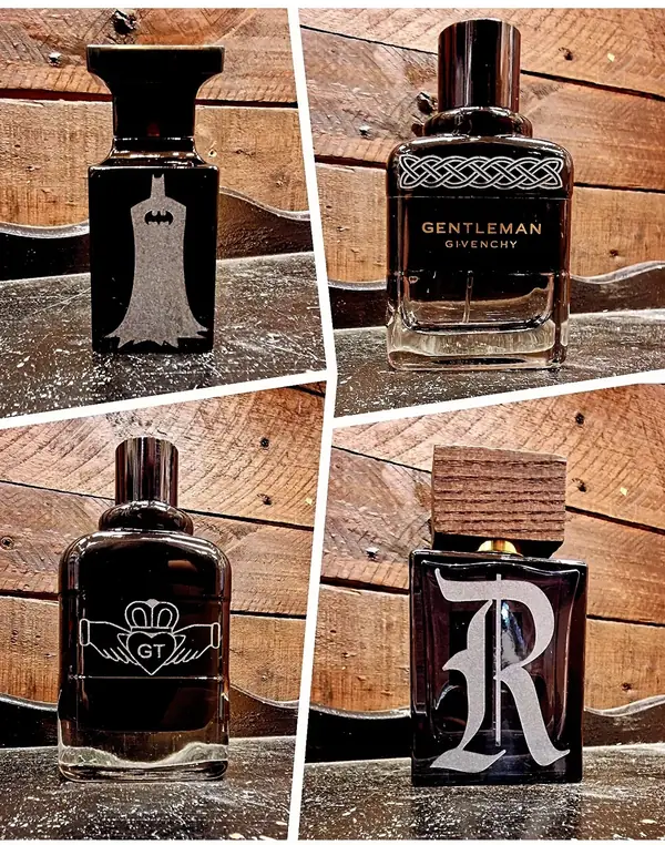 Aftershave bottles engraved with a bat, a Celtic knot, a Claddagh and a letter R