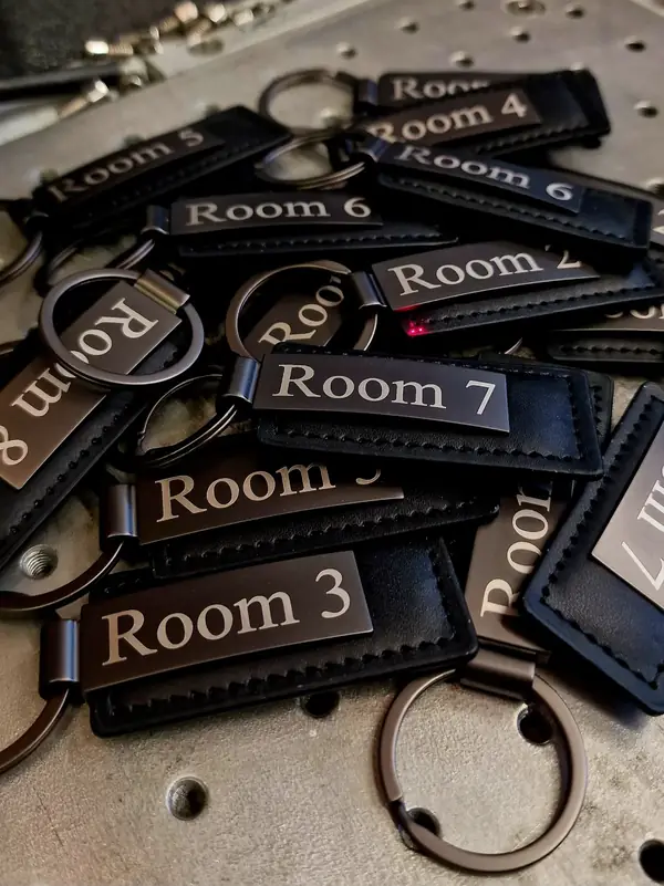 Leather keyrings engraved with room numbers