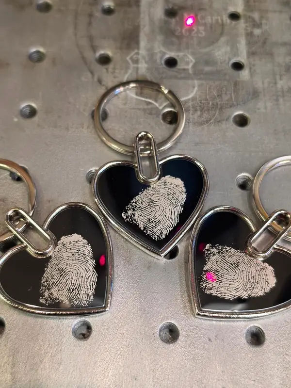 Fingerprints laser-engraved onto heart keyrings