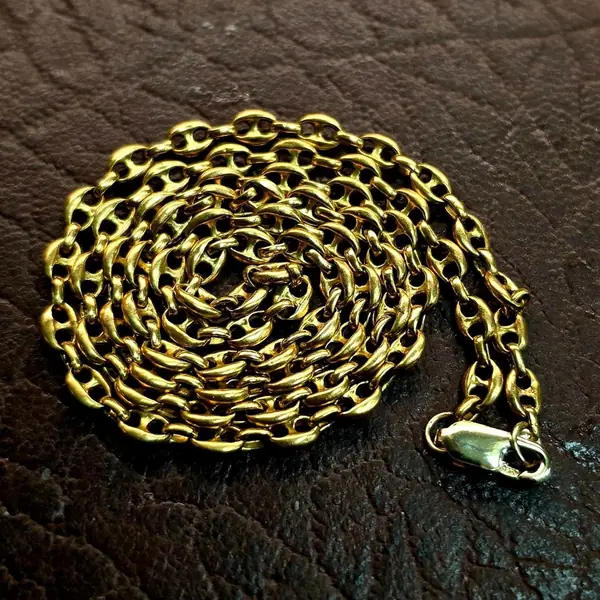 Heavy gold anchor-link chain