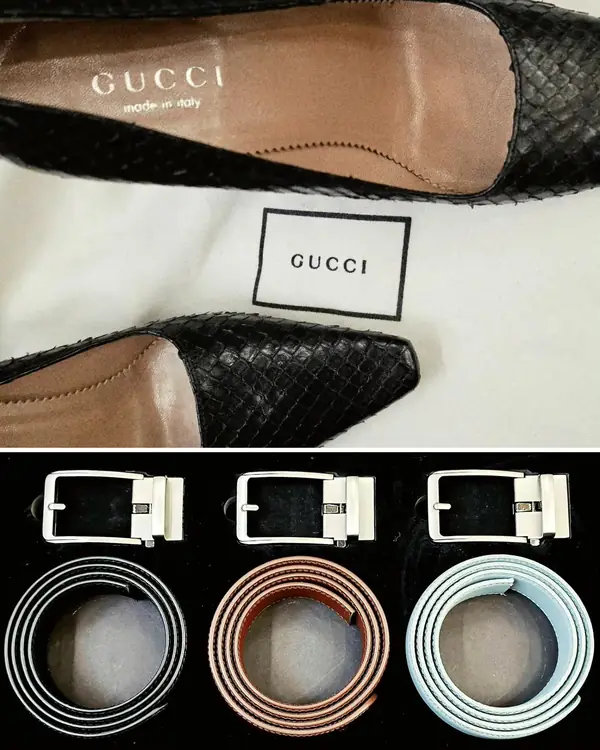 Gucci heels and three leather belts on the bench