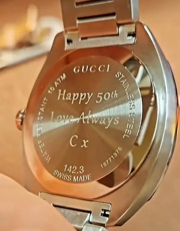 Gucci watch back engraved with a 50th birthday message