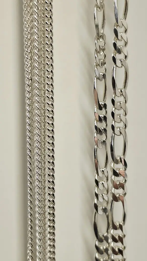 Silver curb and Figaro chains