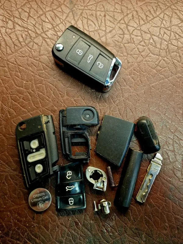 Volkswagen key with its new shell and parts laid out